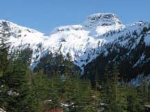 SKWIM: Snowcapped Skwim Mountain looks over the end of the Goat 2 road. (photo by Eagle Walz)